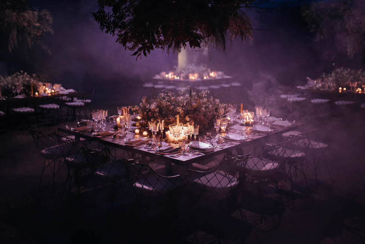 A beautiful purple lit table for a wedding dinner