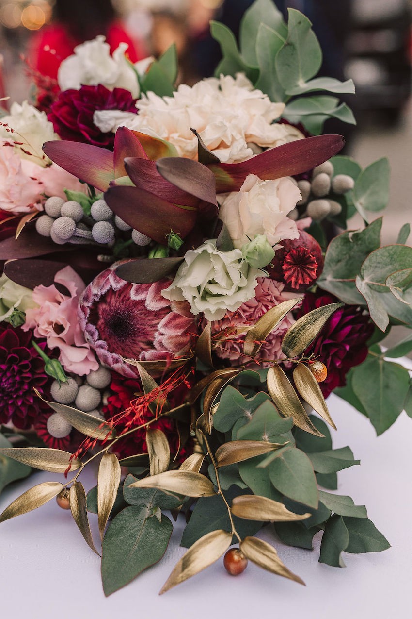 A beautiful bouquet of red and pink wedding flowers