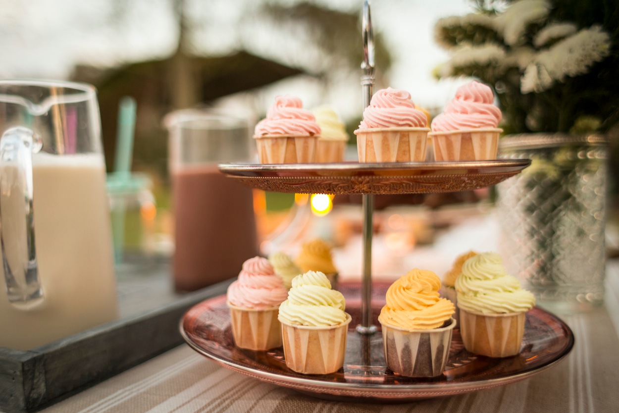 A stack of delicious wedding cupcakes at a wedding reception 