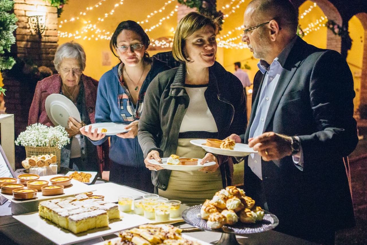 Guests having food at a welcome party