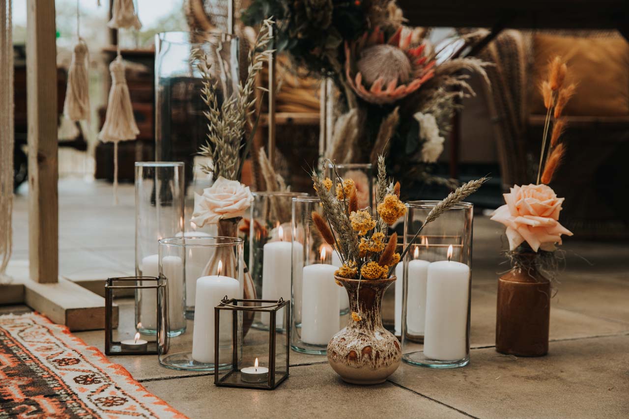 Dried flowers and candles on the floor