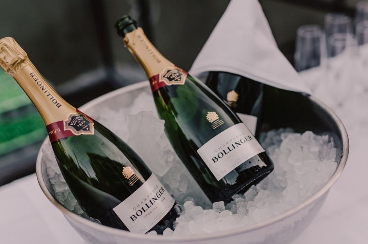 Two bottles of Bollinger Champagne at a destination wedding reception